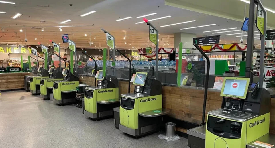 A row of supermarket self checkout machines